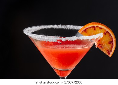 Close-up Detail Of Cocktail Glass With Blood Orange Martini And Sugar, On Black Background, Horizontally, With Copy Space