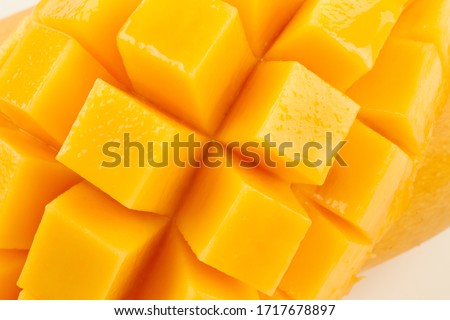 Closeup detail cut slice of ripe mango fruit