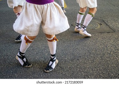 Close-up Detail Of Feet Dancing In The Street With White Espardeñas Esparto Shoes And Stockings. Traditional Dance Concept