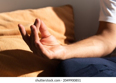 Closeup Detail Of The Hand Of Hispanic Man Meditating Or Making Yoga.