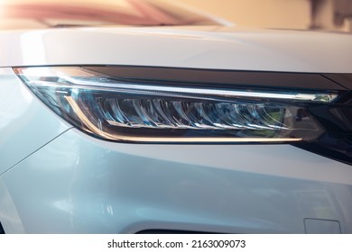 Closeup Detail Of Headlight Of Auto Car Consist Of Led Bulb, Signal Indicator Turn Light, Lamp Part, Daytime Running Light. Concept For Automotive Vehicle, Automobile, Luxury, Polish, Clean And Wash.