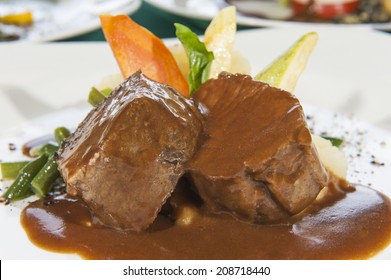 Closeup Detail Of Roast Beef Meal In Gravy With Vegetables