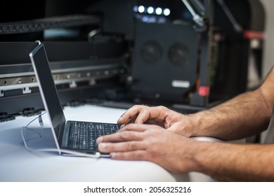 Closeup Detail View Of Laptop Computer. Field Service Maintenance Engineer Technician Electrician Inspect And Control Machine Hardware And Software System. Electric Installation