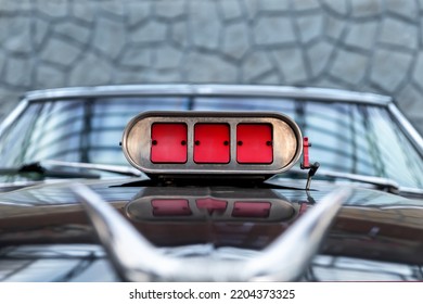 Close-up Detail View Of Old Classic Vintage Retro American Supercharged Muscle Car Red Intake Throttle Valve On Hood Bonnet Chrome Horns Mounted. Street Power Performance Drag Customs Oldtimer Auto