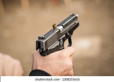Close-up detail view of pistol, handgun, gun malfunctions. Clearance safety drills