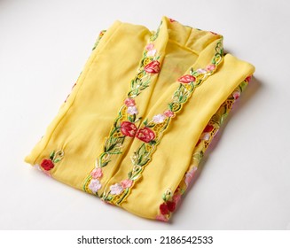 Close-up Details Shot Of Traditional Yellow Kebaya Dress. Nyonya Kebaya In Selective Focus.