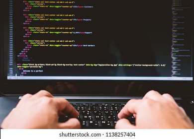 Closeup developing programming and coding technologies on desk white blurry screen, Website design, Programmer working in a software develop company office,Data processing center
