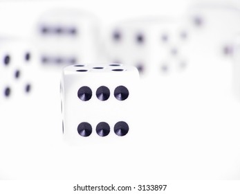 Close-up of dice on white table