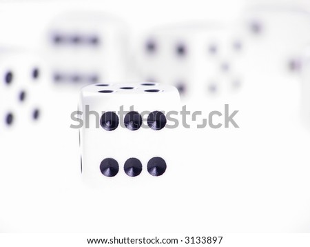 Close-up of dice on white table