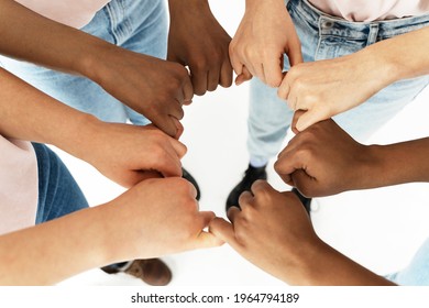 Closeup of different ethnicity female hands. Multicultural diversity and friendship.