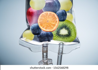 Close-up Of A Different Fruit Slices Inside Saline Bag Hanging With Hook In Hospital
