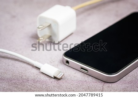 Closeup different size or incompatible usb head of charging wire and usb port on smartphone