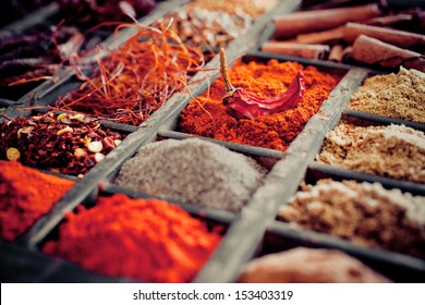 Close-up of different types of Assorted Spices in a wooden box. - Powered by Shutterstock