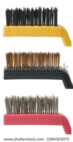 close-up of different wire brushes, copper, steel and nylon industrial brush for rust surface, car mechanical cleaning and polishing, cut out isolated on white background
