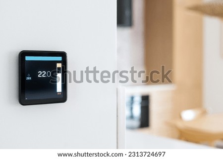 closeup of digital climate control thermostat for adjust temperature mode at home