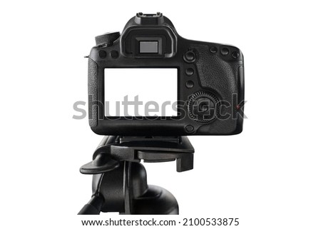 Close-up of digital professional camera with blank screen standing on tripod isolated on white background. Copy space. Vlogging, streaming, social media content. Content creating