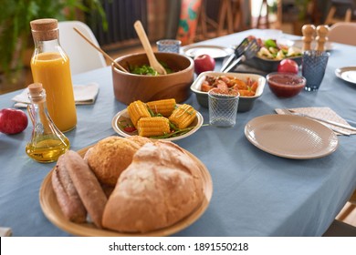 Close-up Of Dinner Table With Salad Vegetables And Meat On It Prepared For Family Dinner