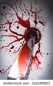 Closeup Of Dirty Bathroom Sink With Blood Splatter And Knife