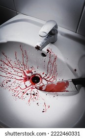 Closeup Of Dirty Bathroom Sink With Blood Splatter And Knife