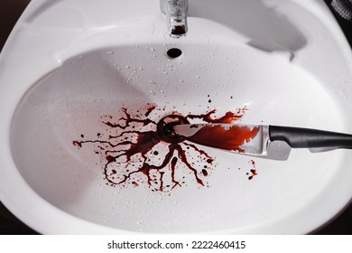 Closeup Of Dirty Bathroom Sink With Blood Splatter And Knife