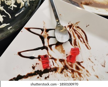 Closeup Of Dirty Plate With Food Leftovers,top View,holiday Leftovers,after Eating Dessert Plate.