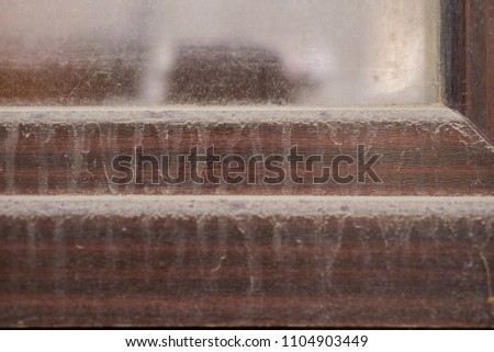 A closeup of a dirty window.
