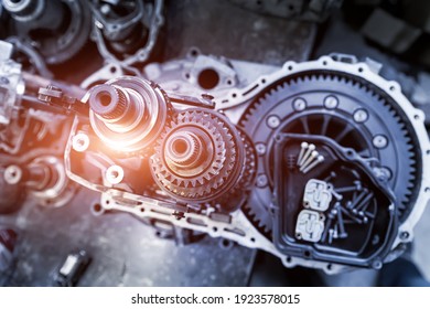 Closeup Disassembled Car Automatic Transmission Gear Part On Workbench At Garage Or Repair Factory Station For Fix Service Or Maintenance. Vehicle Part Detail. Complex Industrial Mechanism Background