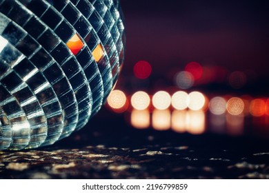 close-up of disco ball against sky at night - Shutterstock ID 2196799859