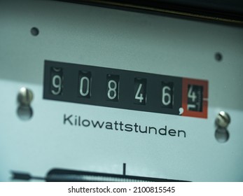 Close-up display of an analog electricity meter. Measurement of used electricity in kilowatt hour (Kilowattstunden).