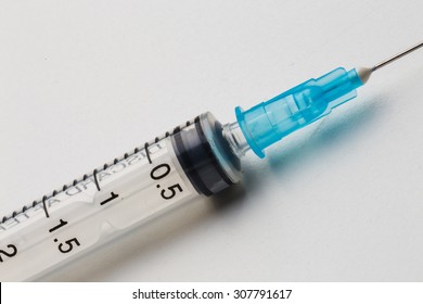 Closeup, Disposable syringe in the row on white background