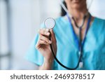 Close-Up of a Doctor Holding a Stethoscope in a Medical Setting