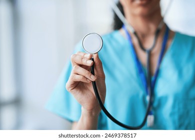 Close-Up of a Doctor Holding a Stethoscope in a Medical Setting - Powered by Shutterstock