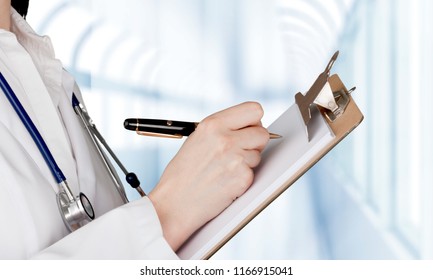 Close-up Doctor at hospital working with tablet pc - Shutterstock ID 1166915041