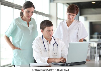 closeup of doctor and nurses in a meeting
