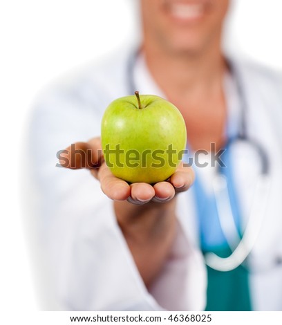 Close-up of a doctor presenting a green apple against a white background
