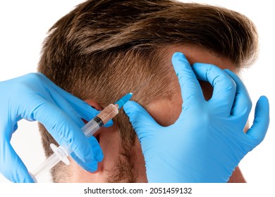 Closeup Of Doctor's Hand With A Syringe And Man Receiving Scalp Injection For Hair Grow