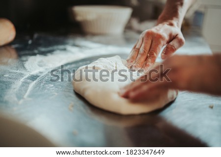 Similar – Foto Bild Frau beim Kneten von handwerklichem Brot auf Holztisch