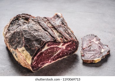 Close-up dried beef meat on board in meat shop. - Powered by Shutterstock