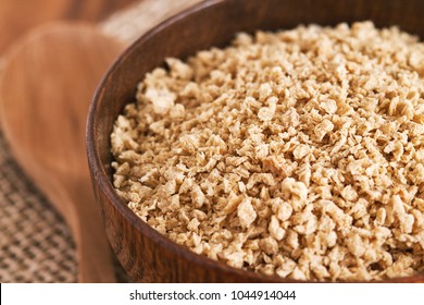 Closeup Of Dried Raw Soya Mince In Wooden Bowl