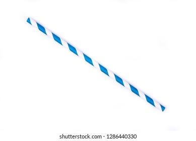 Closeup of drinking straw for party. Blue spiral. Top view of colorful disposable eco-friendly straw for summer cocktails. Paper coctail colorful straw isolated on white  background, isolated.