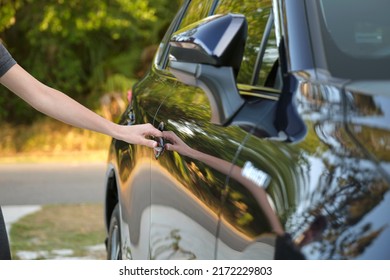 Closeup Of Driver Hand Opening Car Front Door