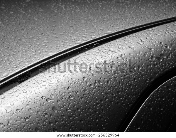 closeup drops of\
water on the car after\
rain