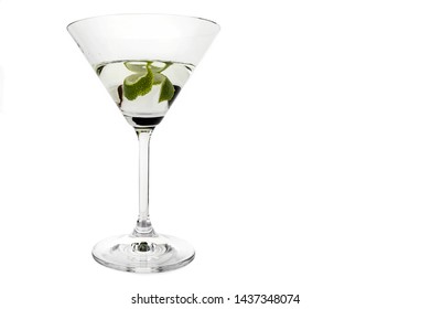 Close-up Of Dry Martini With Lime Peel In A White Background