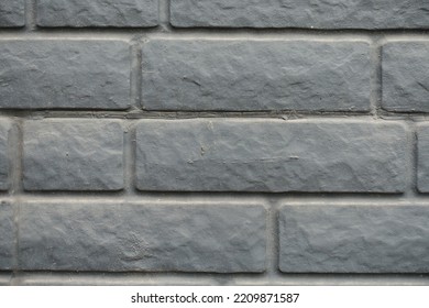 Closeup Of Dusty Black Painted Brick Veneer Wall