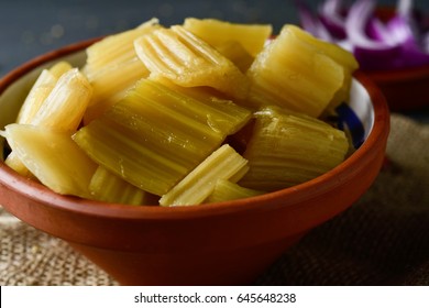 Closeup Of An Earthenware Bowl With Cooked Cardoon, Typically Eaten In Spain, On A Rustic Wooden Table