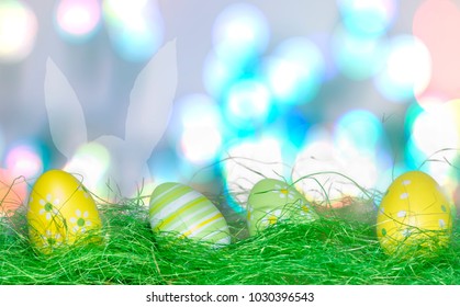 Closeup easter eggs rabbit shadow, bokeh light