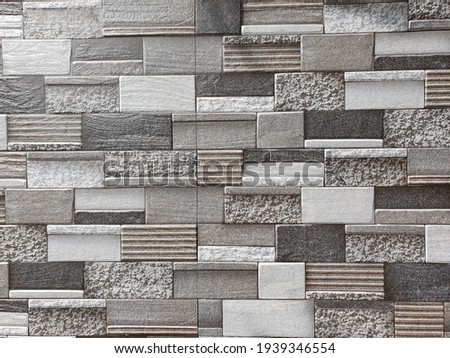 Closeup. eclectic gray and brown bricks. Wallpaper.