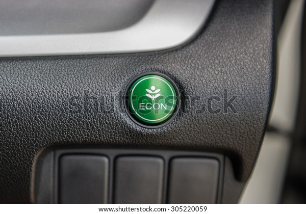 Closeup of\
Economic button on the car\
dashboard