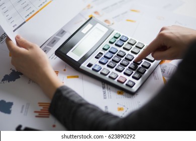 Closeup Of Economist Using Calculator