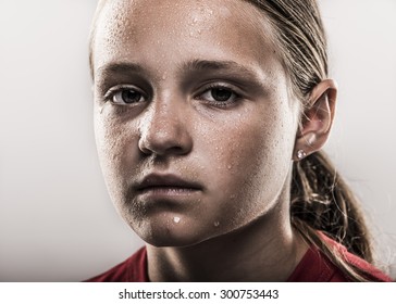 Closeup of edgy softball girl looking tough with sweat - Powered by Shutterstock